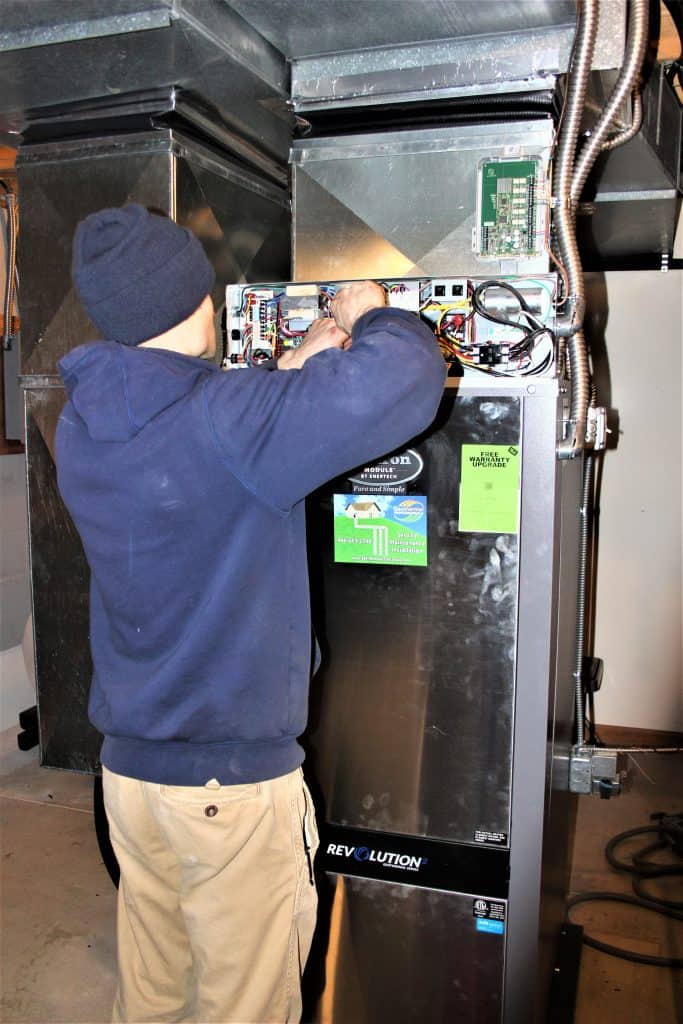 Technician calibrating the same indoor unit